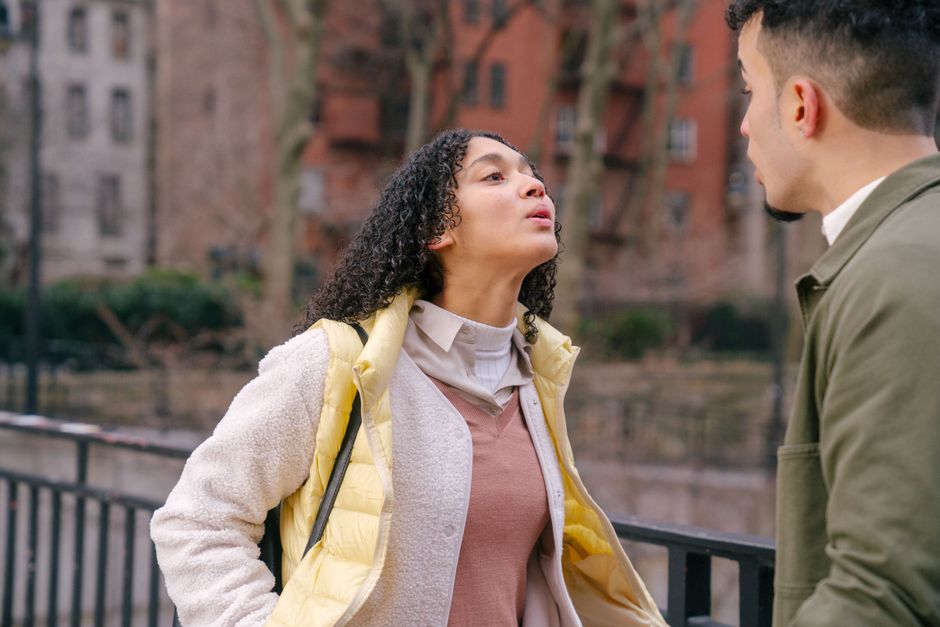 Two people talking with tension in a relationship
