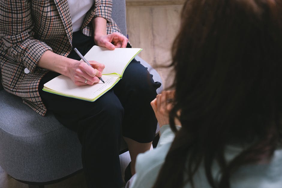 Therapy session with notes and reflective discussion