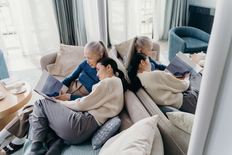 Calm family reading together in a cozy living room, illustrating a meaningful simple life