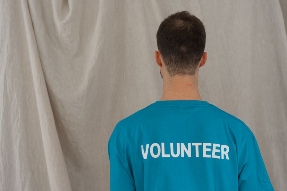 People volunteering and helping others in a community setting