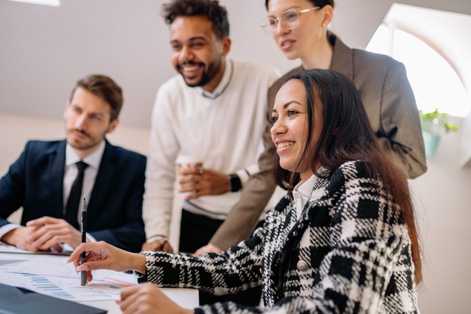 Team collaboration in a modern office, illustrating collective accomplishment