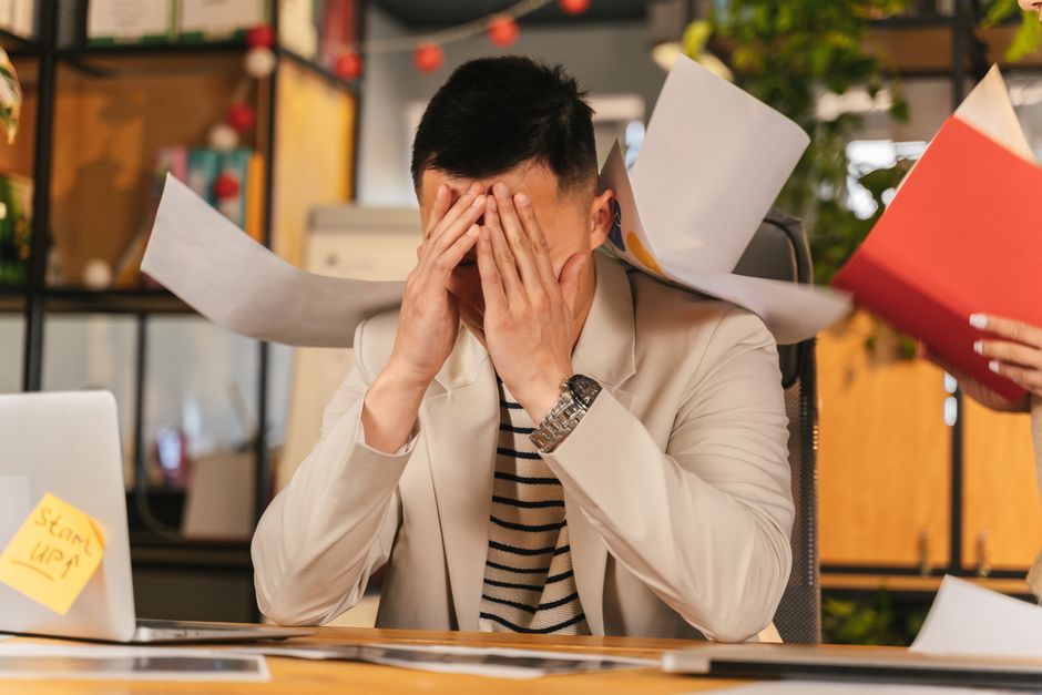 Person feeling conflicted at work, illustrating misalignment with values