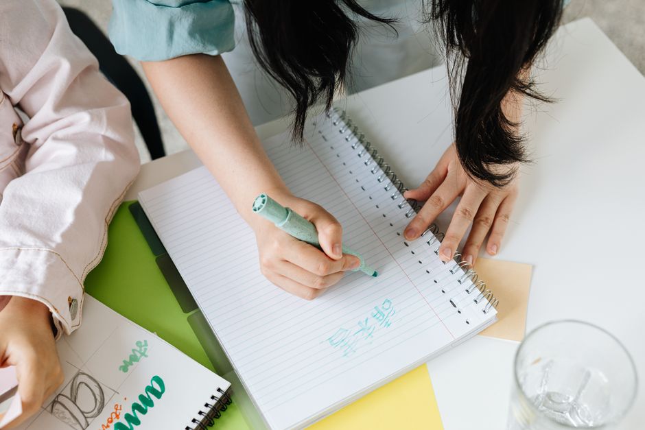 Person planning career path with notes and roadmap on a table