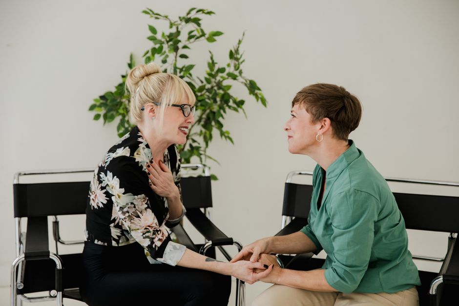 Two adults having a supportive one-on-one conversation