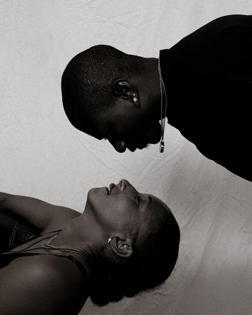 Artistic black and white portrait showing intimate connection between two people.