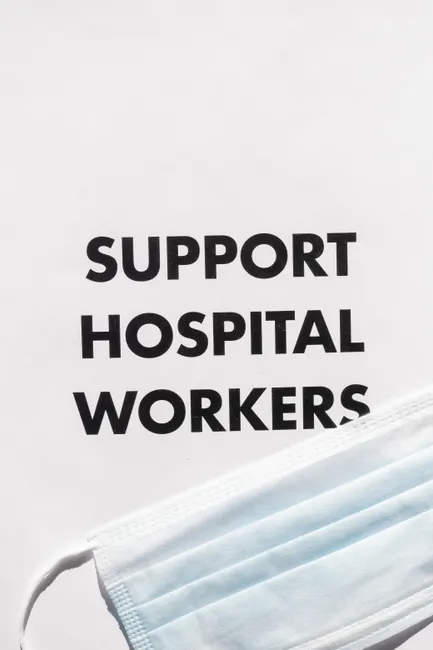 Image featuring 'Support Hospital Workers' text and a face mask symbolizing healthcare solidarity.