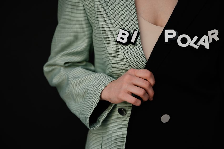 Image illustrating bipolar disorder concept with text on a dual-tone jacket.