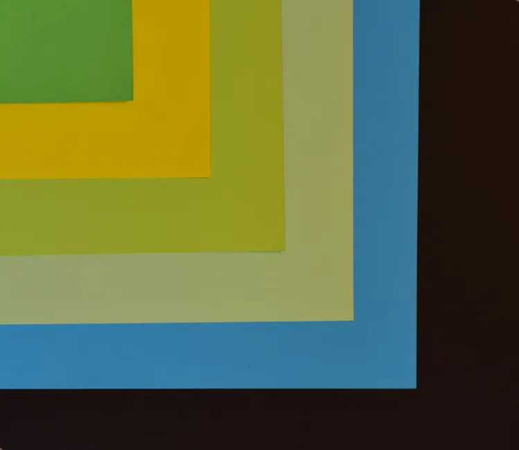 Abstract composition with colorful layered paper creating a geometric pattern.