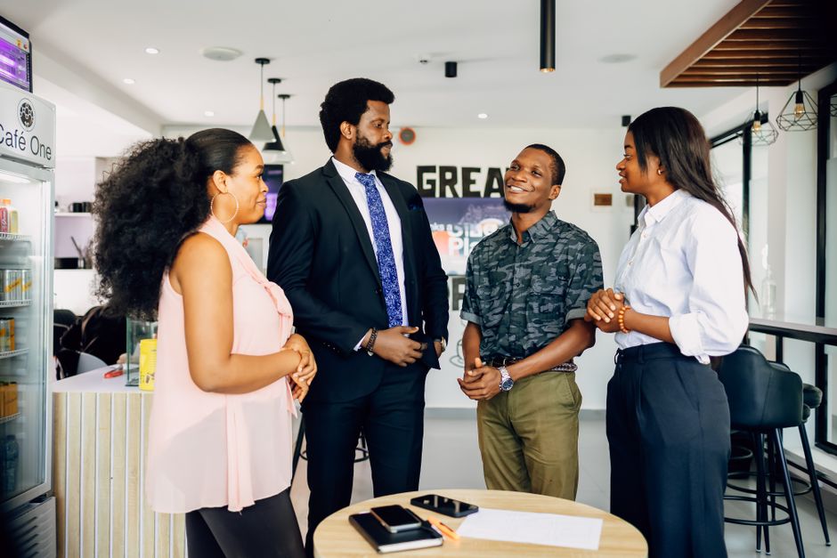 Group of professionals having a casual meeting in an office setting in Lagos.